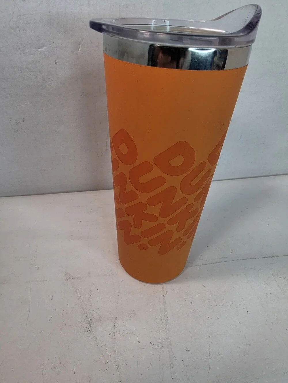 Dunkin' 20 oz Insulated Stainless Steel Tumbler, vibrant orange soft touch grip.